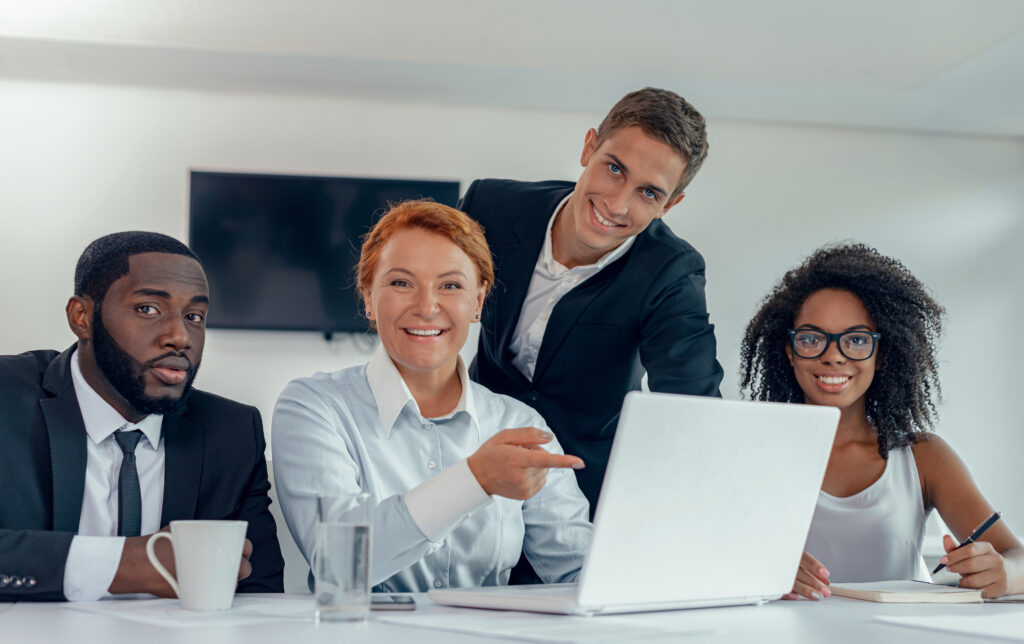 Happy group of business people working together in modern office